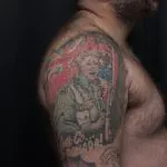 A photo of the shoulder tattoo after one treatment, 12 weeks later.