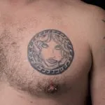 A photo of the Medusa tattoo on the chest, before any laser tattoo removal treatments.