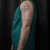 A photo of a Black & Gray 8 Years old tattoo on the Arm on a person with FitzPatrick Skin Type ii. This client is hoping for Cover Up Tattoo