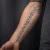 A photo of a Black & Gray and Script 17 Years old tattoo on the forearm on a person with FitzPatrick Skin Type iii. This client is hoping for Complete Removal