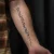 A photo of a Black & Gray and Script 17 Years tattoo on the forearm on a person with FitzPatrick Skin Type iii 14 Weeks after their treatment. This client is hoping for Complete Removal